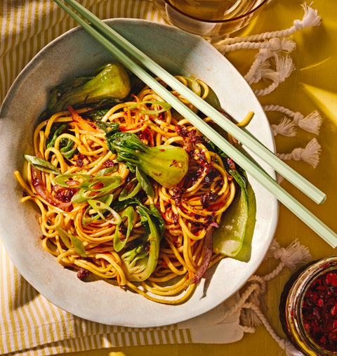 Noodles and Fly by Jing Chili Crisp in a bowl, photo by Maya Visnyei