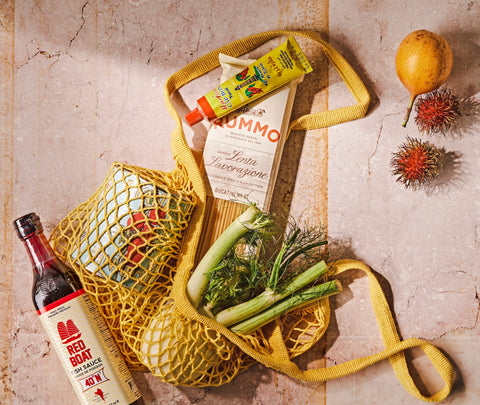 Shopping bag with Red Boat Fish Sauce, Harissa, Bianco de Napoli Canned Tomatoes, Photo by Maya Visnyei