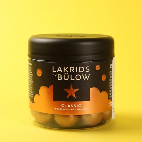 Jar of Lakrids by Bulow on a yellow background