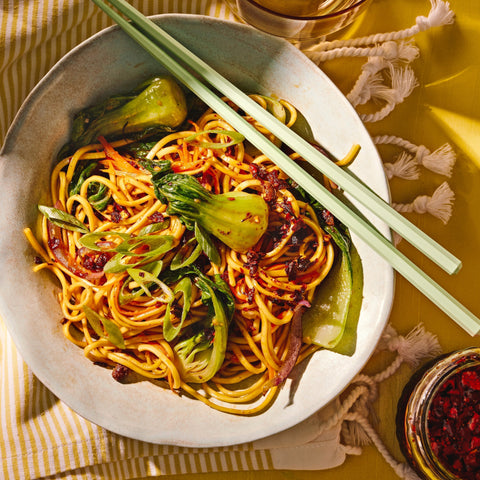 Vegetable Noodle Stir Fry in a bowl with Fly by Jing Chili Crisp