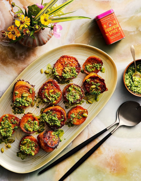 Roasted sweet potato rounds with Diaspora Co Pumpkin Spice honey, topped with parsley and pepita pesto