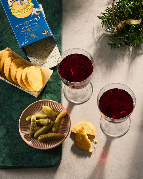 Isle of Mull Cheddar Biscuits, Viniteau cornichons and glasses of red wine.