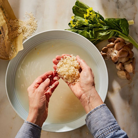 Tamaki Haiga Rice being washed in a bowl of water