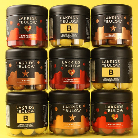 Multiple jars of Lakrids by Bulow on a yellow background