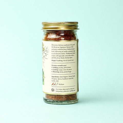 a jar of NewYorkShukHerbyHarissa with the labele turned to show the 
Ingredient List