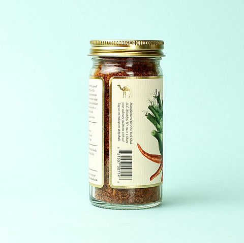 a jar of NewYorkShukHerbyHarissa with the label turned to show the barcode